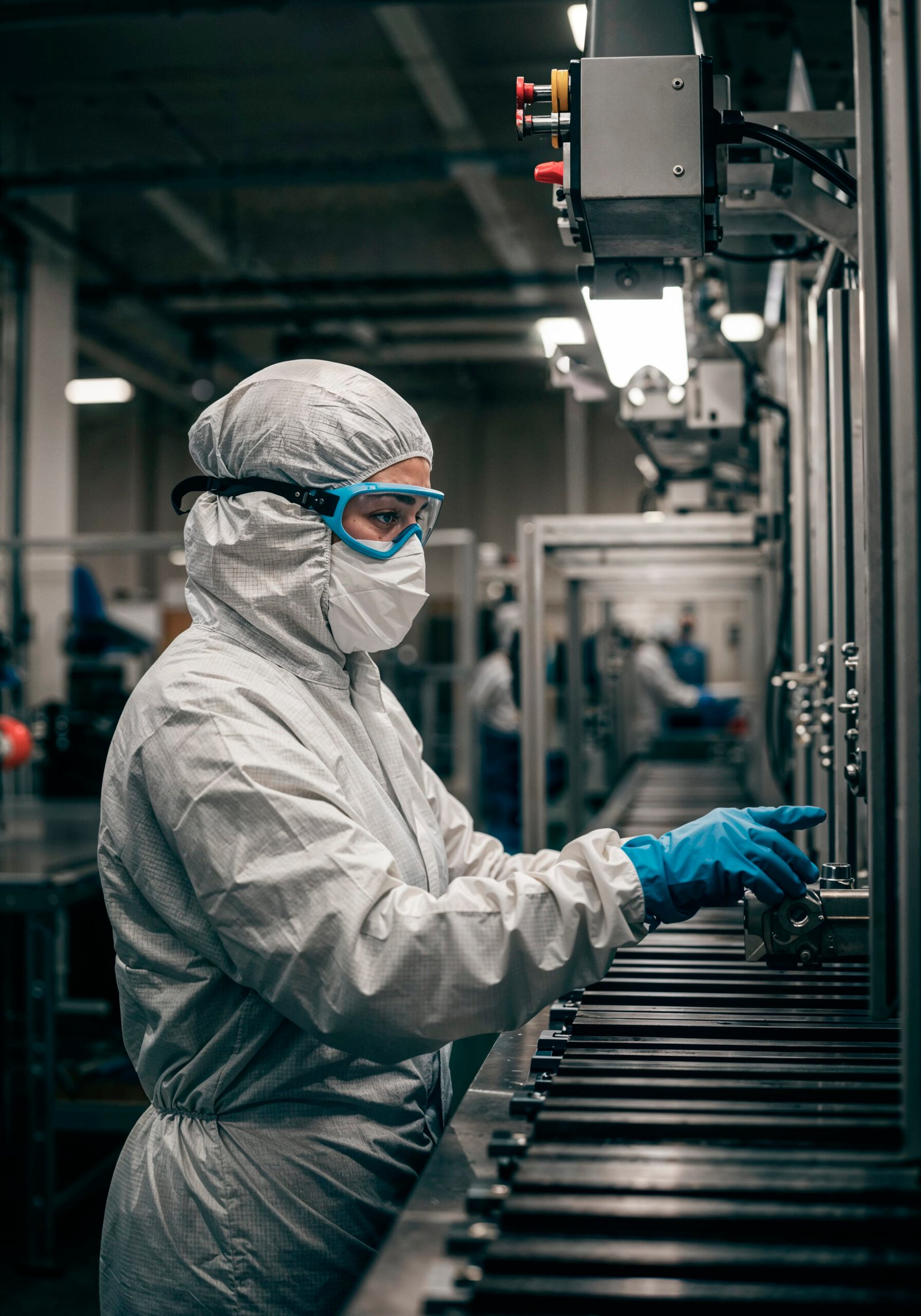 factory-worker-protective-suit-operating-machinery